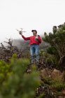 Man operating a flying drone in countryside — Stock Photo