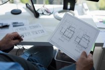 Mid section of man looking at architectural chart — Stock Photo