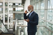Businessman talking on the phone in the office — Stock Photo