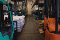 Various materials in rack at warehouse — Stock Photo