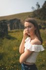 Portrait Beautiful woman standing in a meadow — Stock Photo
