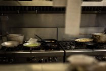 Food being prepared in kitchen at restaurant — Stock Photo
