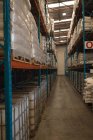 Various materials in rack at warehouse — Stock Photo