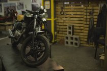 Close-up of motorbike at garage — Stock Photo