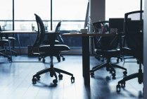 Empty desk with chairs and table in office — Stock Photo