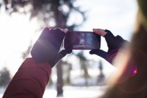 Close-up of woman clicking a picture on smart phone — Stock Photo