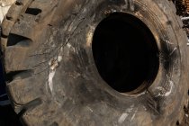 Close-up of burnt rubber tyre in the scrapyard — Stock Photo