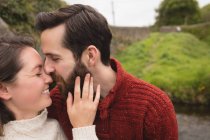 Affectionate couple kissing each other — Stock Photo
