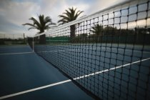 Close-up of net in tennis court at dawn — Stock Photo