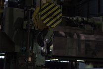 Hook of crane lifting metal equipment in metal industry — Stock Photo