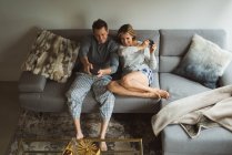 Couple playing video games in living room at home — Stock Photo