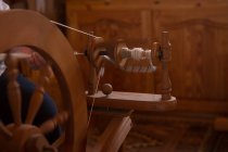 Close-up of weaving loom with silk thread at shop — Stock Photo