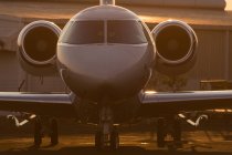 Private jet at terminal in soft light — Stock Photo