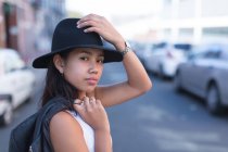 Portrait of teenage girl posing in city street — Stock Photo