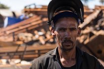 Portrait of scrapyard worker looking at the camera — Stock Photo