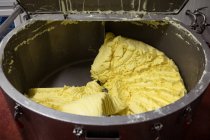 Prepared batter in huge machinery at factory — Stock Photo