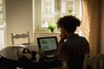 Woman working on laptop at home — Stock Photo