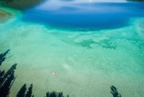 Aerial of turquoise water in the shallow banks along the coast line — Stock Photo