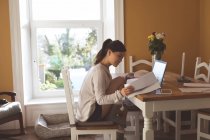 Young woman working at home — Stock Photo