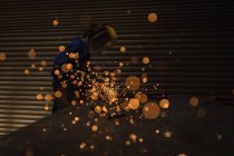 Female welder using welding torch in workshop. — Stock Photo