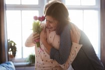 Senior woman and daughter hugging each other at daytime — Stock Photo