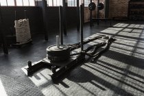 Cross fit rope equipment in fitness studio in sunlight. — Stock Photo
