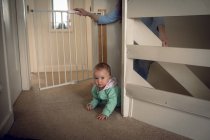 Adorable baby girl crawling at home — Stock Photo