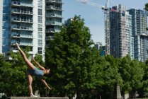Young female ballet dancer dancing in the city — Stock Photo