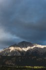Scenic view of dark clouds over the beautiful mountain — Stock Photo