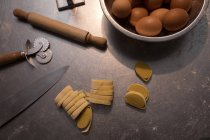 Fresh pasta on a counter with ingredient in bakery — Stock Photo