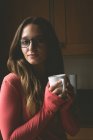 Beautiful woman having coffee at home — Stock Photo