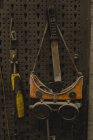 Close-up of protective eyewear and tool in garage — Stock Photo