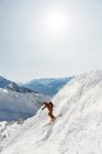 Skier skiing on a snowy mountain during winter — Stock Photo