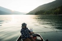 Fisherman fishing in the river on a sunny day — Stock Photo