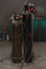 Close-up of gas cylinders in garage — Stock Photo