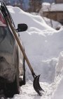 Close-up of snow shovel on a car during winter — Stock Photo