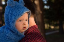 Close-up of father holding his baby boy in the park — Stock Photo