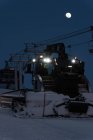 Modern snowplow truck in snowy season at night — Stock Photo
