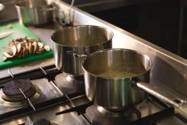 Close-up of pan on a gas stove in kitchen — Stock Photo