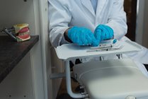 Mid section of dentist tools on tray in clinic — Stock Photo