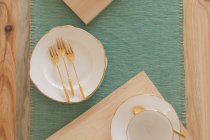 Close-up of cutlery on a place mat — Stock Photo