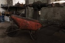 Close-up of wheelbarrow in forge workshop — Stock Photo