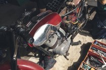 Close-up of motorbike in repair garage — Stock Photo