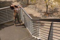 High angle view of urban dancer practicing dance on stairs. — Stock Photo