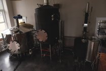 Wine distillery storage tank in factory interior — Stock Photo