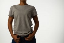 Mid section of casual woman posing against white background. — Stock Photo
