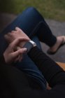 Mid section of woman using smartwatch — Stock Photo