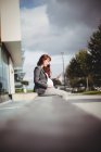 Pregnant businesswoman using digital tablet in office premises — Stock Photo