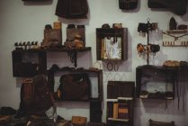 Various leather accessories hanging in workshop — Stock Photo