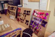 Artificial dreadlocks on desk in shop — Stock Photo